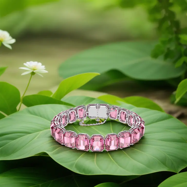 a bracelet on leaf, flowers in defocused background